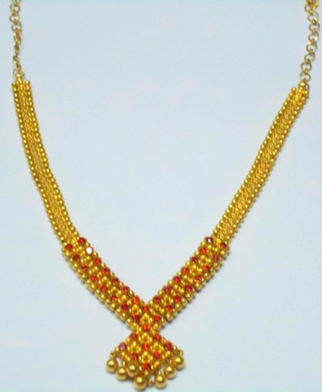 gold necklace with red stones