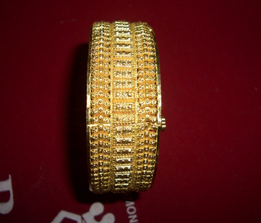 gold screw bangle