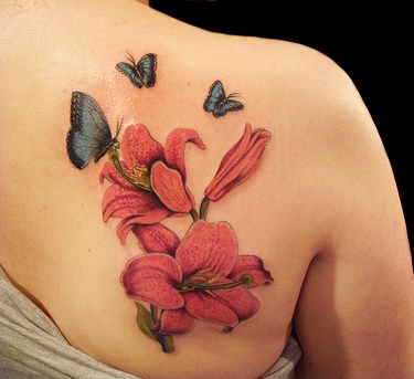 Flower and butterfly tattoo