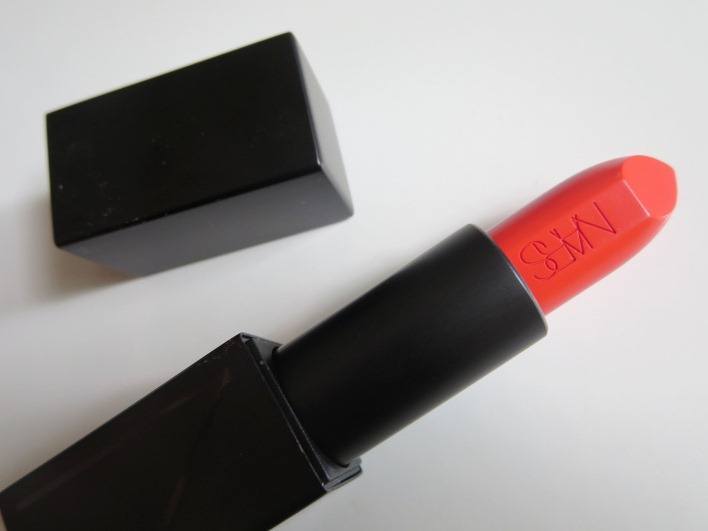 Bright orange lipstick