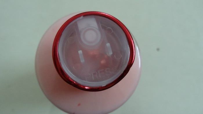 press button under bottle cap