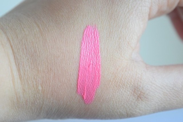 Pink lip gloss hand swatch