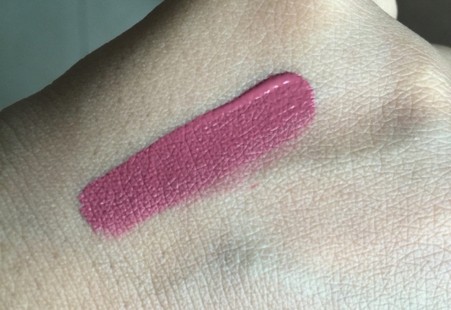 Huda Beauty Liquid Matte Trophy Wife Lipstick swatch on hands