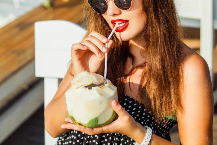 beautiful-woman-drinking-coconut-water