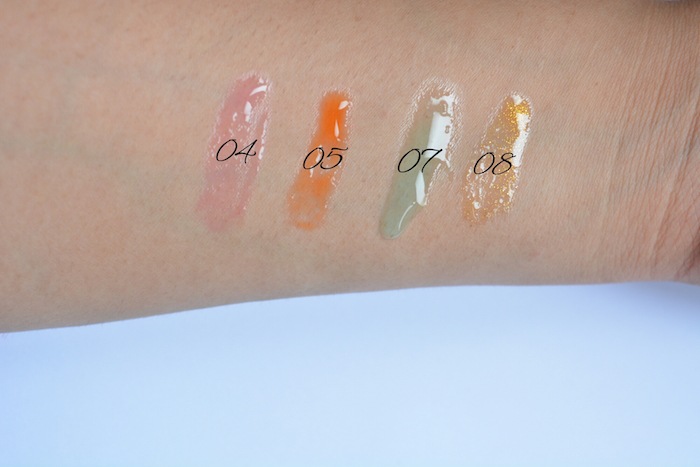 Clarins Instant Light Lip Comfort Oil Candy swatch on hand