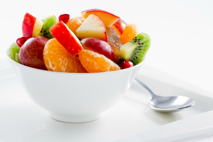 Diet healthy fruit salad in the white bowl healthy breakfast weight loss concept