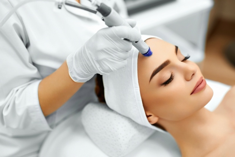 Face Skin Care. Close-up Of Woman Getting Facial Hydro Microdermabrasion Peeling Treatment At Cosmetic Beauty Spa Clinic.