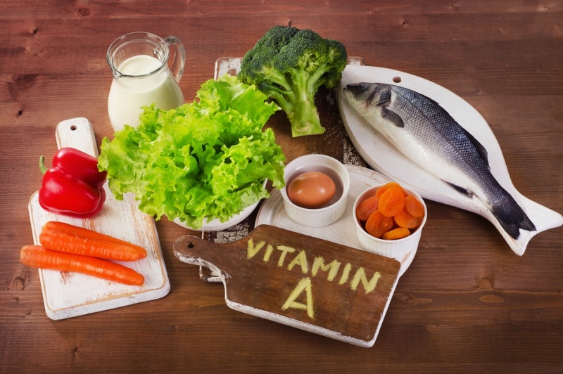 Foods containing vitamin A on a wooden table