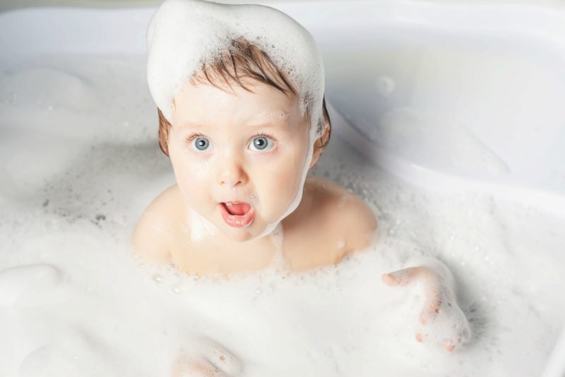 Baby wash in the bath. Use soap, shampoo for children. Baby shampoo not sting eyes