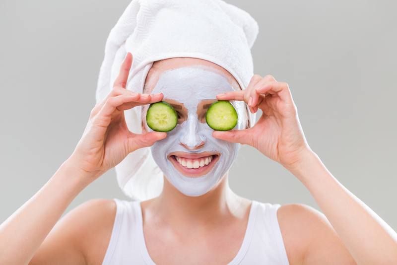 Green cucumber slices on eyes