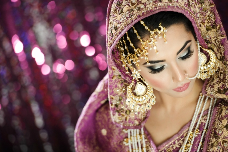 Portrait of a Beautiful Elegant Female Model in Traditional Ethnic Indian Asian Bridal Costume with Makeup and Heavy Jewellery