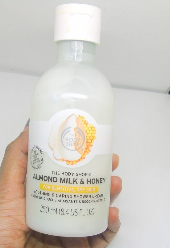 The Body Shop Almond Milk & Honey Soothing & Caring Shower Cream Review Bottle in Hand