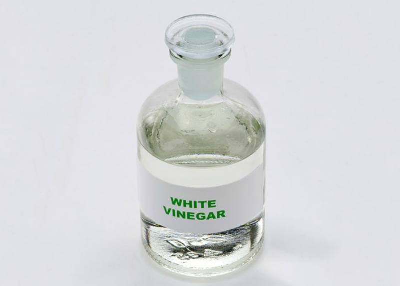 White vinegar in a glass bottle