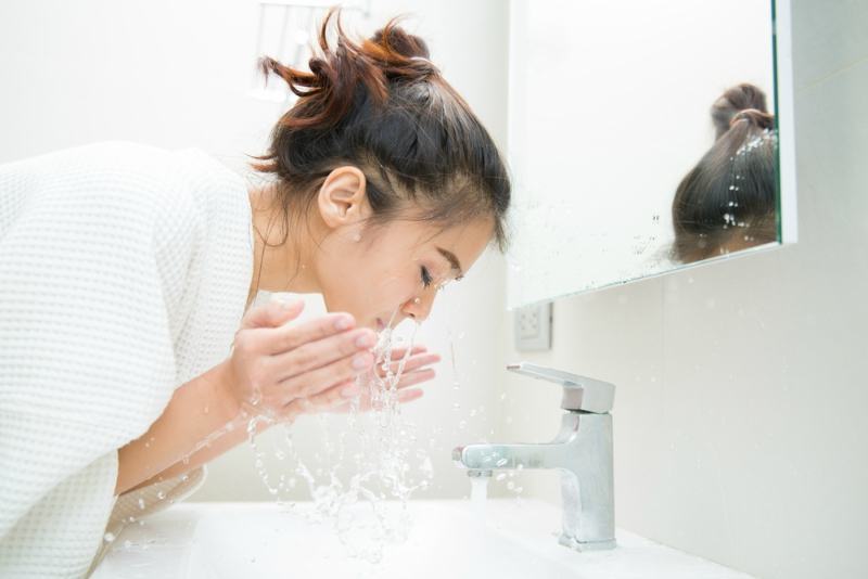 Woman wakes from sleep and she was cleansing the morning before shower