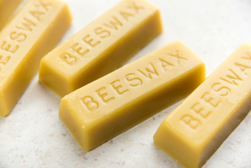 Yellow Beeswax Bars on Marble Counter Top