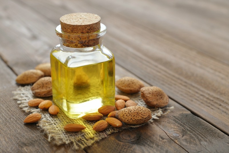 almonds and almond oil on a table