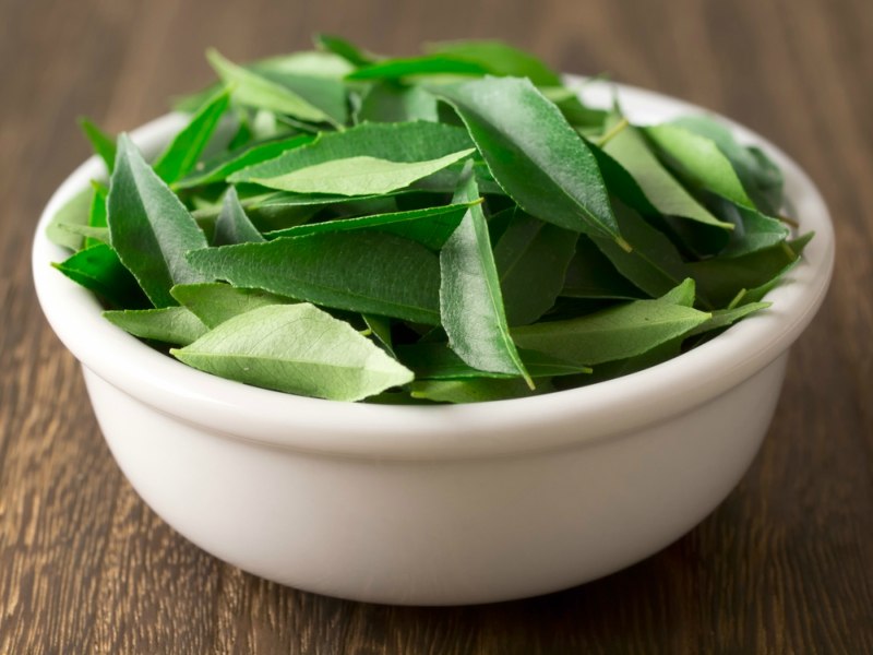 indian curry leaves in a bowl