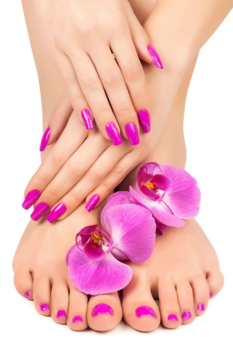 woman hands and feet with nail polish