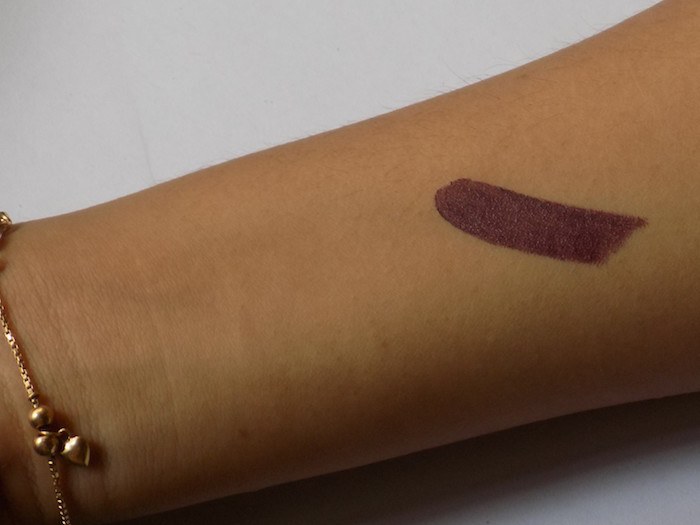 MAC Smoked Purple Lipstick swatch on hand.